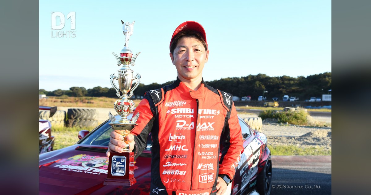 Naotaka Nakagawa holding the D1 Lights winner's trophy beside his red Shibatire S15 after Round 9 at Tsukuruma Circuit Nasu, from D1's official round report