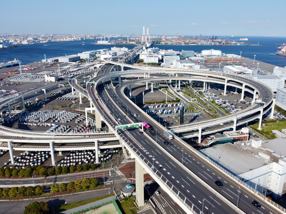 Aerial view of Daikoku Junction, the spiral expressway interchange with Daikoku Parking Area sitting inside the loop