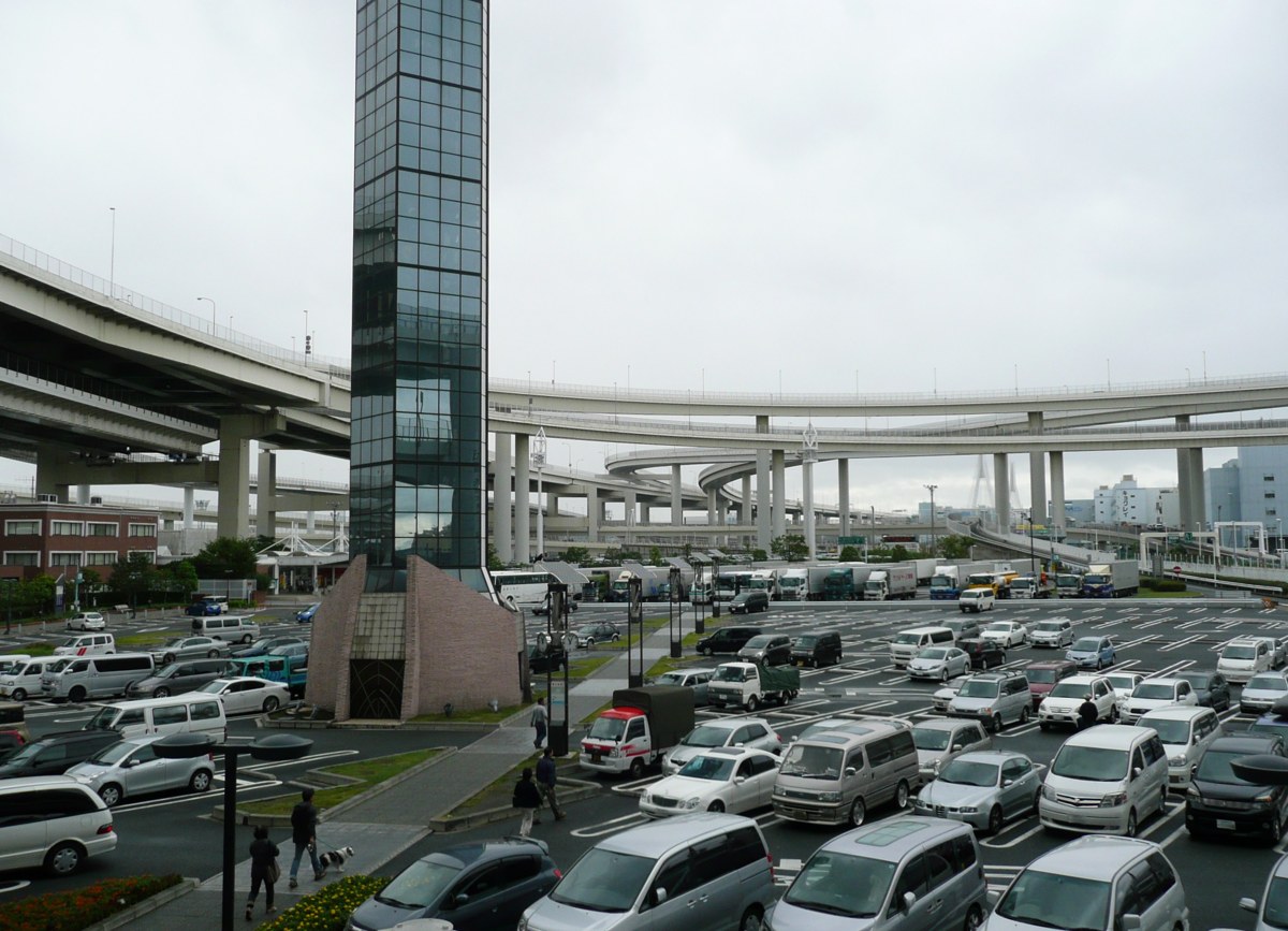 The Daikoku PA car park on an ordinary afternoon, ringed by the looping ramps of Daikoku Junction