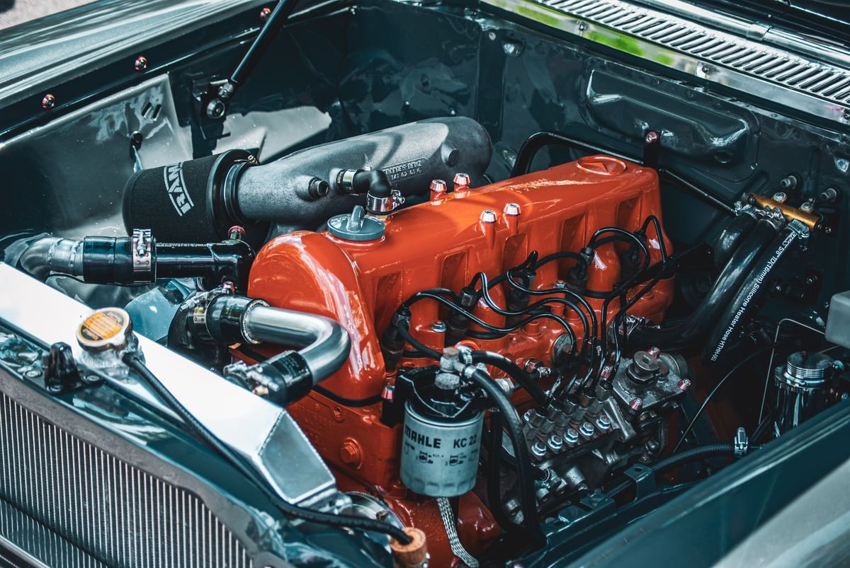 A tidy engine bay with the intake and cam cover visible