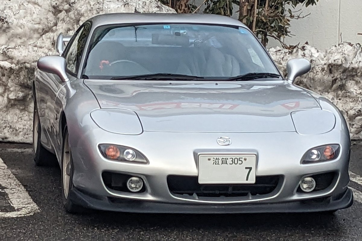 A silver Mazda RX-7 FD3S Type RS on Japanese plates